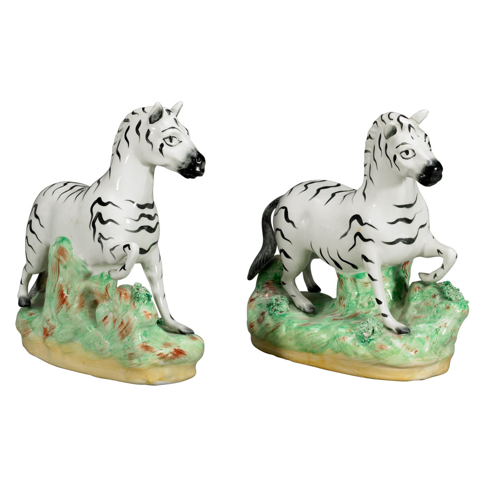 Appraisal: Pair of Staffordshire Pottery Zebras late th century minor restoration