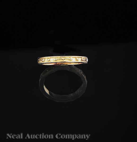 Appraisal: A Matthew Trent kt Yellow Gold Band swirl motif