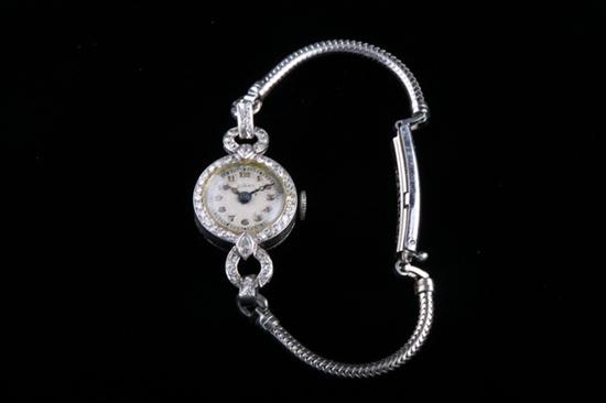 Appraisal: LADY'S VINTAGE PLATINUM AND DIAMOND WRISTWATCH By Birks Canada Round