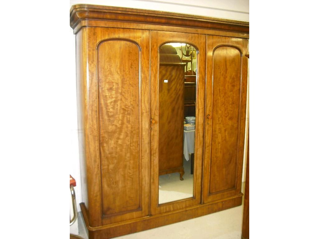 Appraisal: Good Victorian mahogany combination wardrobe the stepped moulded cornice over