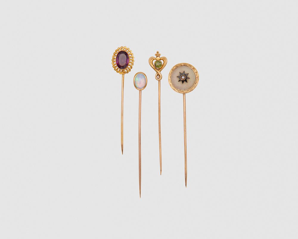 Appraisal: Four Gold and Gemset Stickpins Four Gold and Gemset Stickpins