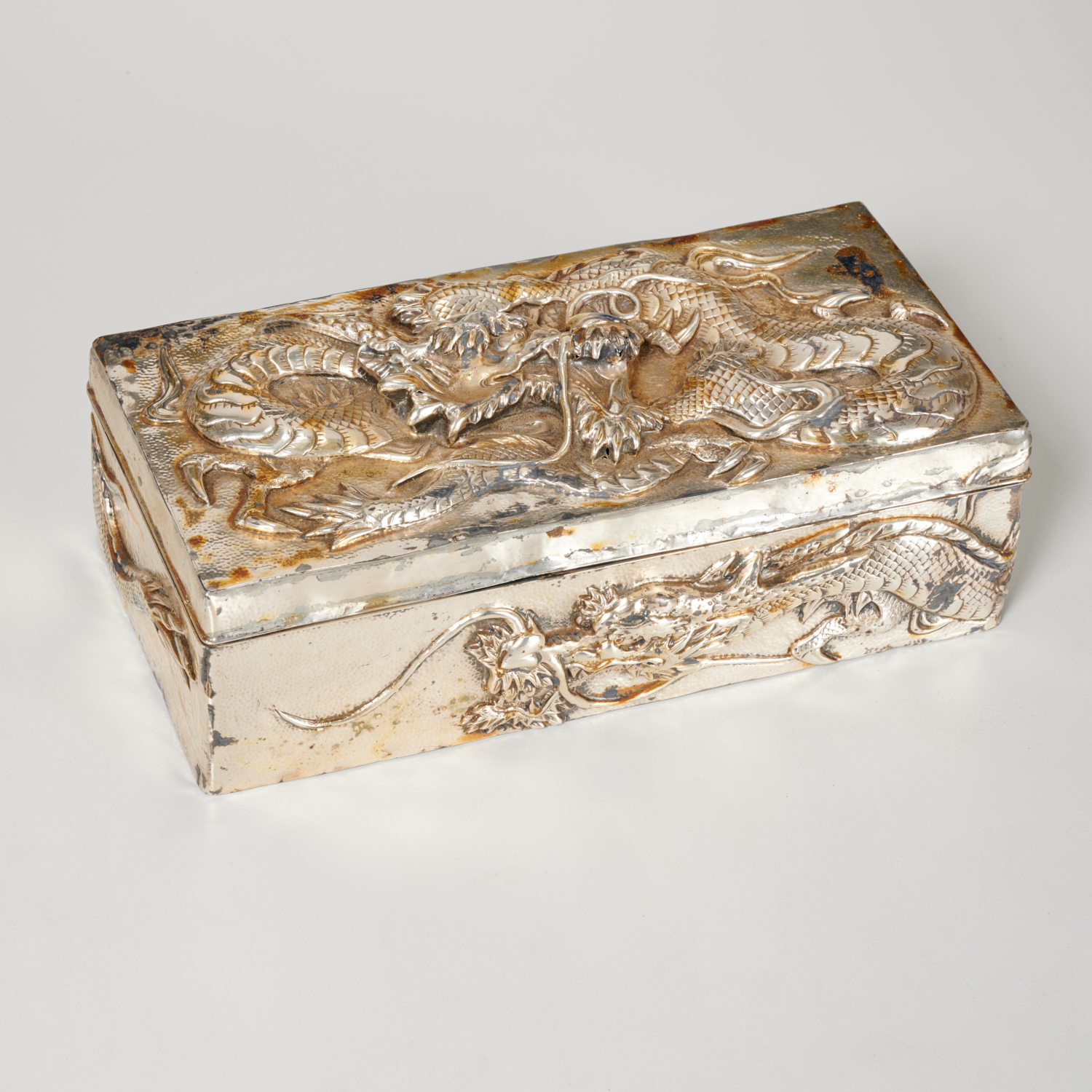 Appraisal: KUHN KOMOR ASIAN EXPORT SILVER DRAGON BOX c chased and