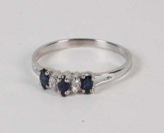 Appraisal: K WHITE GOLD DIAMOND AND SAPPHIRE BAND K WHITE GOLD