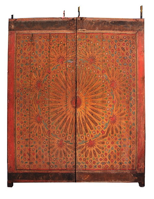 Appraisal: A PAIR OF ANTIQUE MOROCCAN DOORS with painted sunburst and