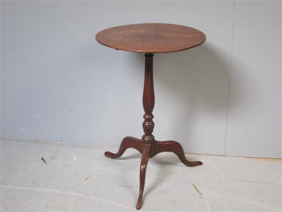 Appraisal: George III oak round tilt top table on turned column