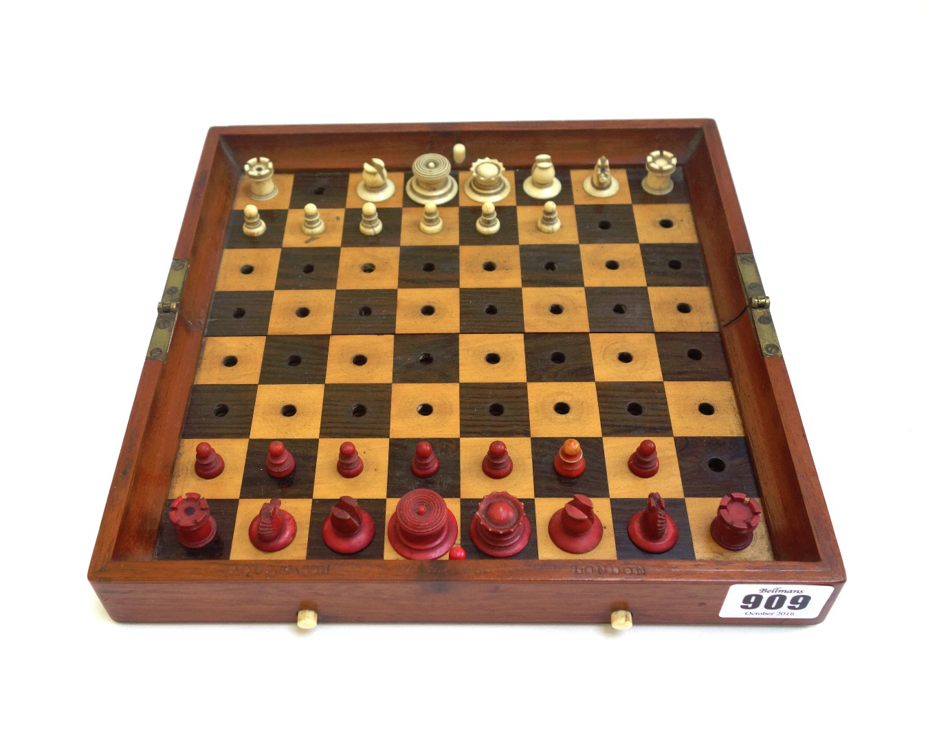 Appraisal: A Jaques 'In Statu Quo' stained bone travelling chess set