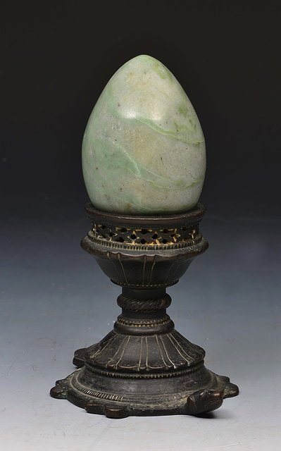 Appraisal: AN INDIAN BRONZE CANDLE HOLDER in the form of a