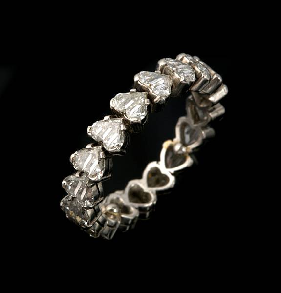 Appraisal: A diamond eternity band set throughout with profile-cut heart-shaped diamonds