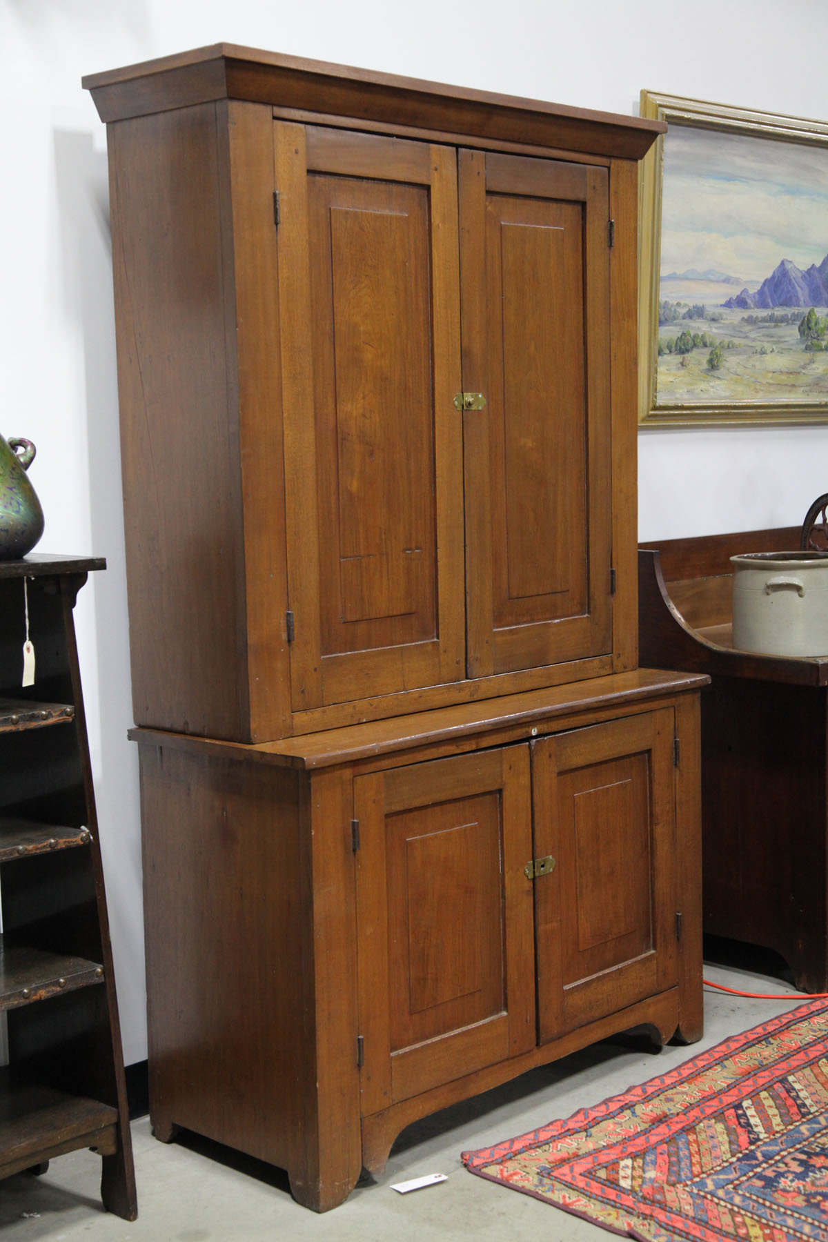 Appraisal: TWO PIECE STEPBACK CUPBOARD American second half th century Walnut