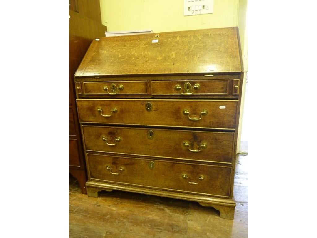 Appraisal: A Georgian oak bureau the fall front enclosing a fitted