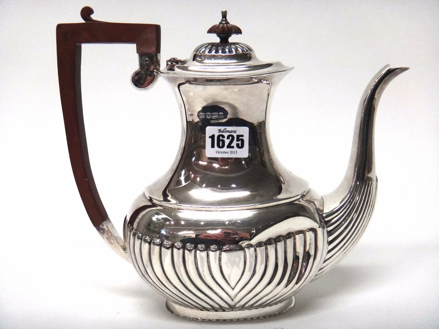 Appraisal: A silver coffee pot with partly curved fluted decoration to