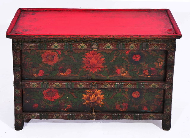 Appraisal: A TIBETAN PAINTED MANUSCRIPT CHEST with hinged door and polychrome