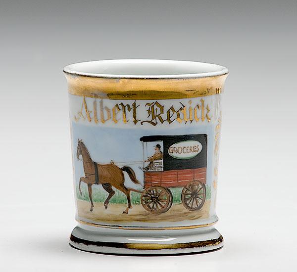 Appraisal: OCCUPATIONAL SHAVING MUG WITH GROCERY WAGON porcelain with polychrome painted