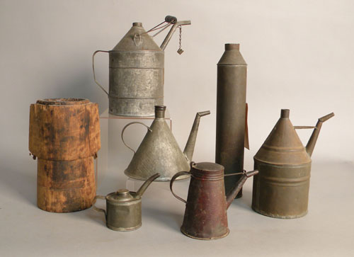 Appraisal: Five tin lamp fillers th c together with tin parade