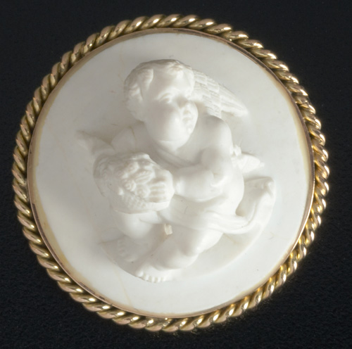 Appraisal: Meerchaum cameo presentation brooch depicting putto with basket and flowers