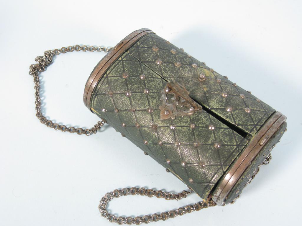 Appraisal: A green leather Sewing Necessaire of cylindrical shape with cut