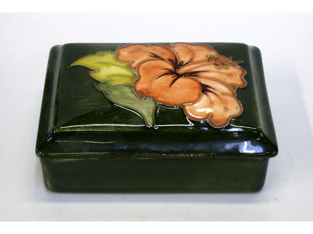 Appraisal: Moorcroft 'Hibiscus' pattern rectangular box and cover on green ground