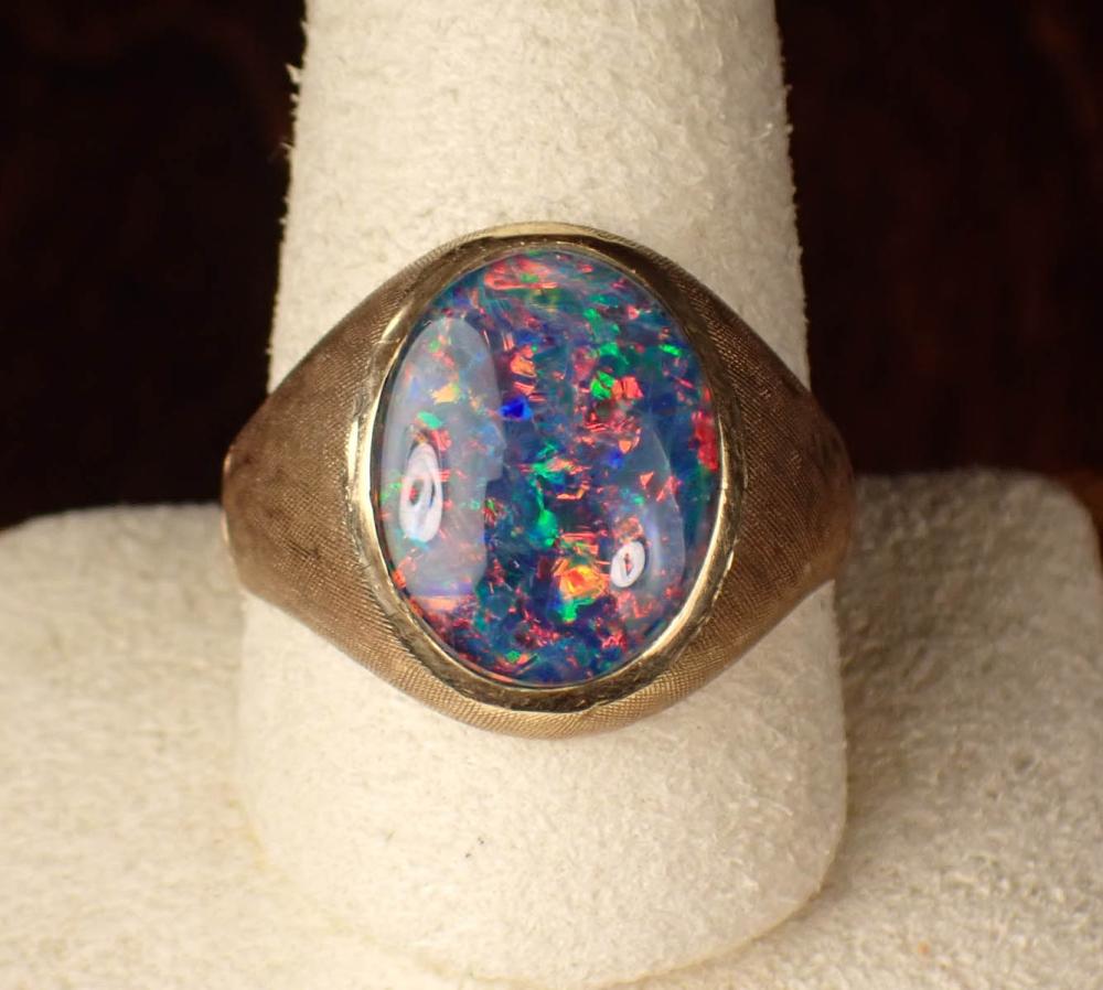 Appraisal: MAN'S OPAL TRIPLET AND FOURTEEN KARAT GOLD RING bezel set