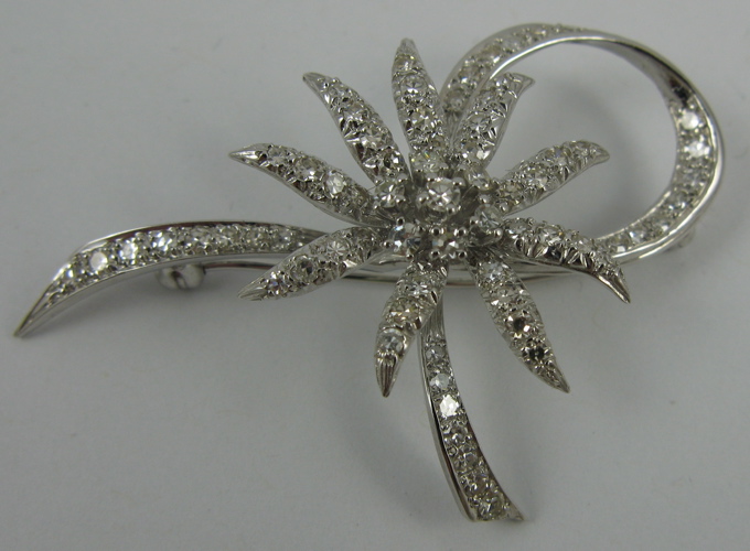 Appraisal: DIAMOND AND K WHITE GOLD FASHION BROOCH set with round-cut