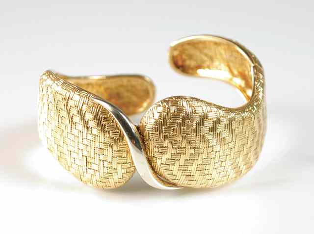 Appraisal: FOURTEEN KARAT GOLD BANGLE weighing grams