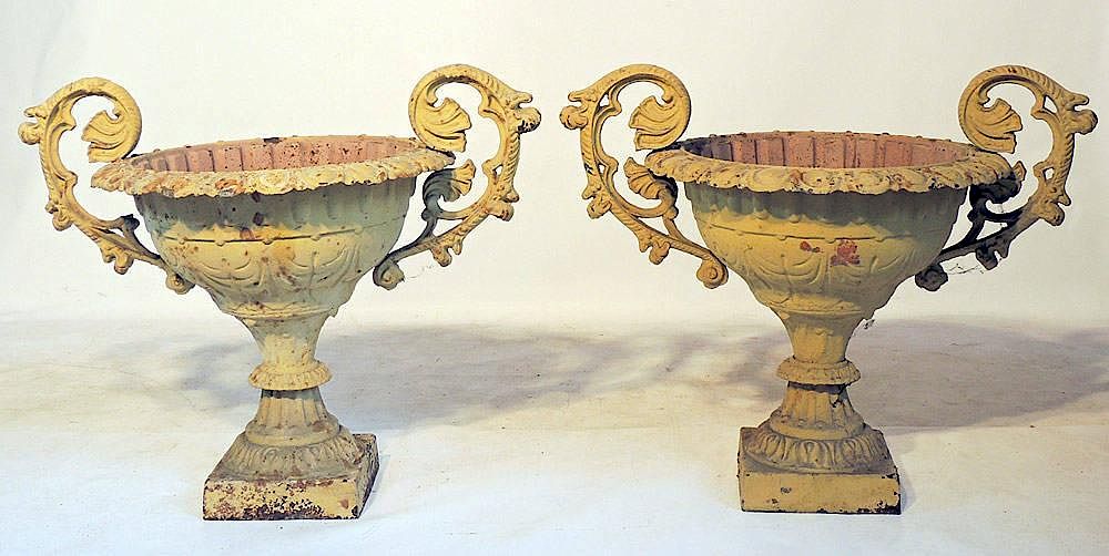 Appraisal: Pair of Cast Iron Garden Urns Classical form With bases