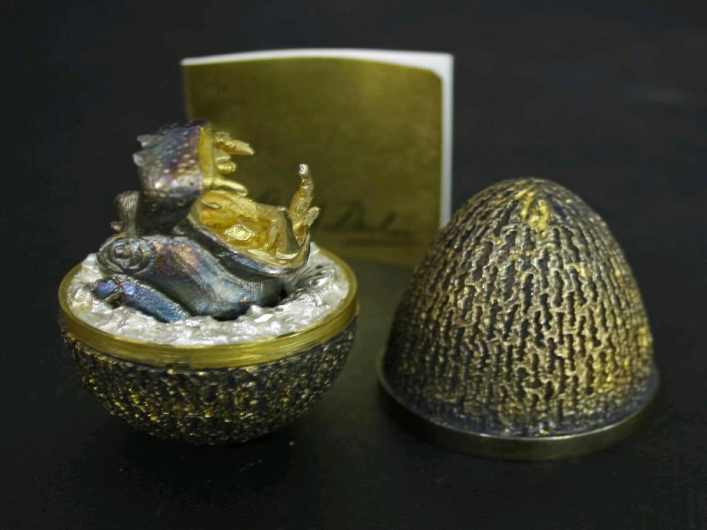 Appraisal: Stuart Devlin silver-gilt Easter egg limited edition the naturalistic fluted