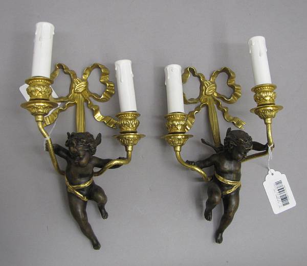 Appraisal: A pair of Louis XV style patinated and gilt bronze