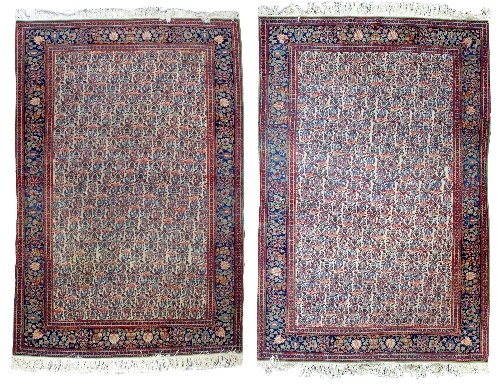 Appraisal: A pair of Kashan rugs the central camel ground field