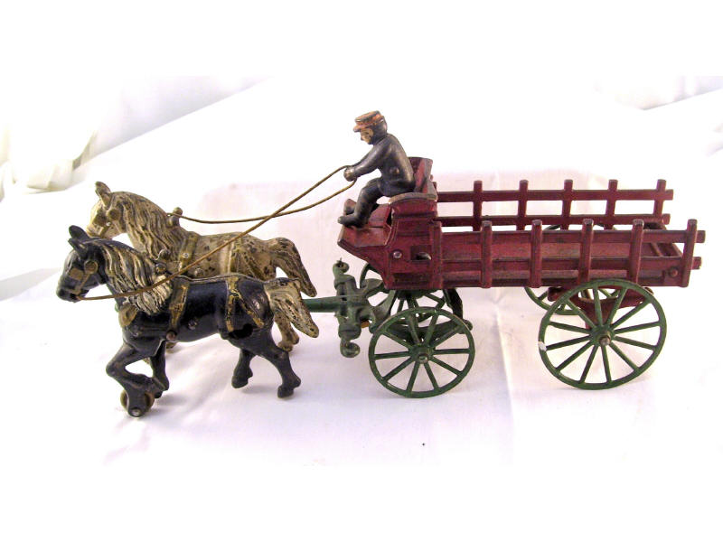 Appraisal: Cast Iron Two Horse Drawn Wagon Original paint Unmarked Measures