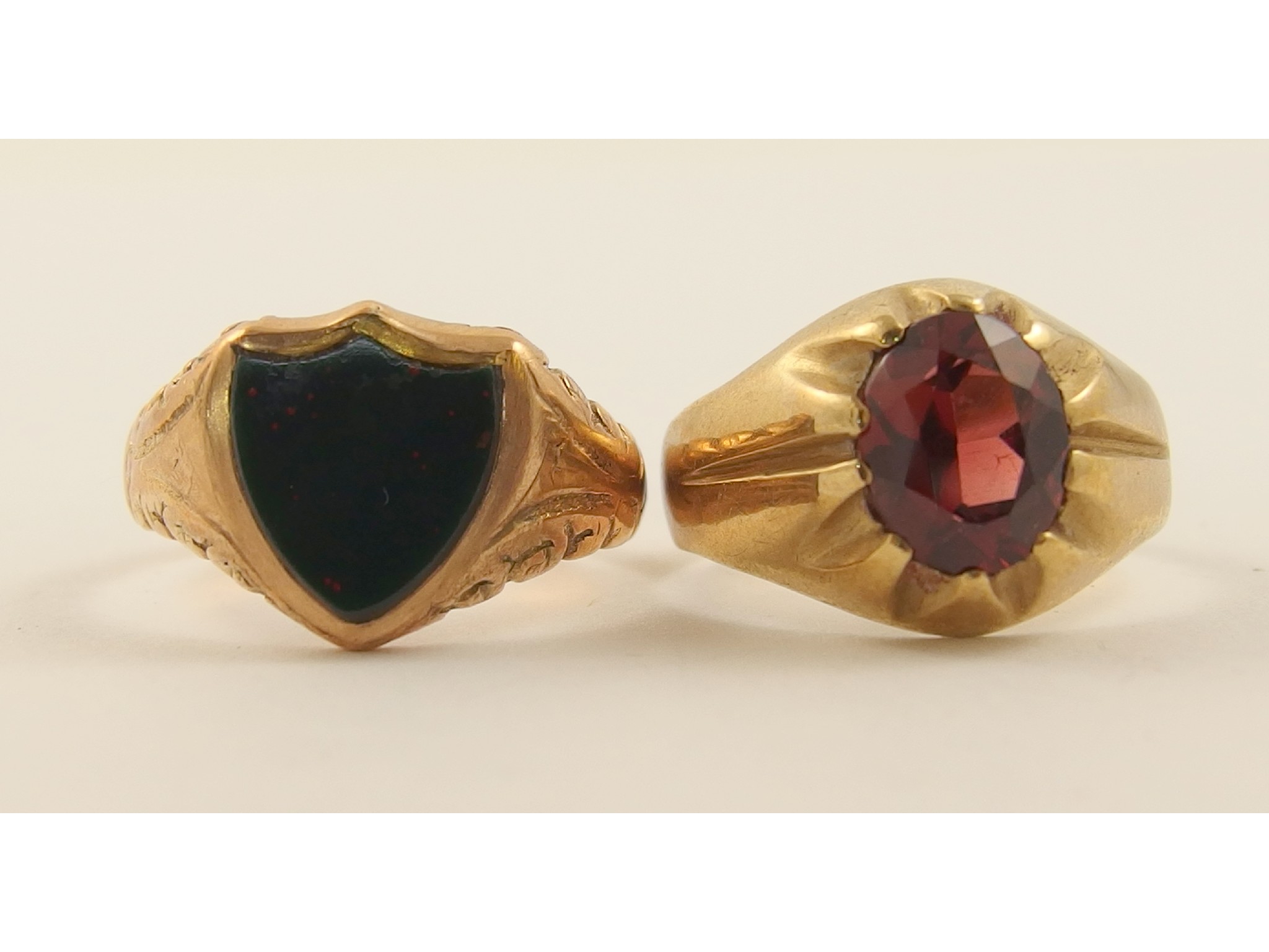 Appraisal: A shield shaped bloodstone signet ring and a ct red