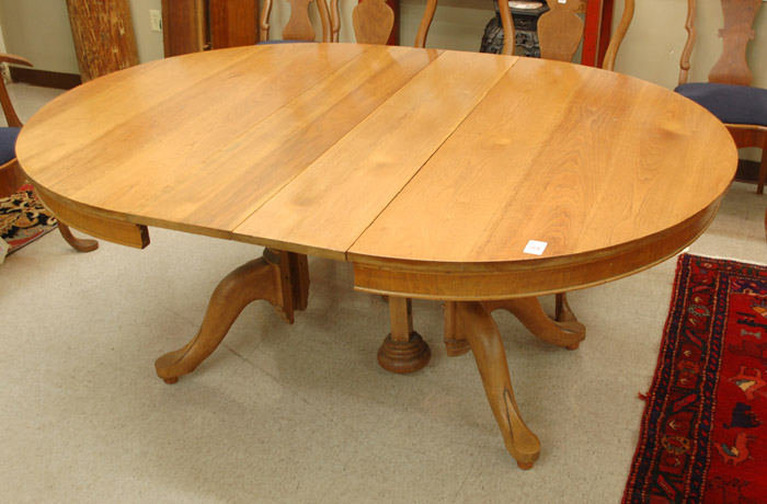 Appraisal: ROUND WALNUT DINING TABLE WITH NINE LEAVES American th century