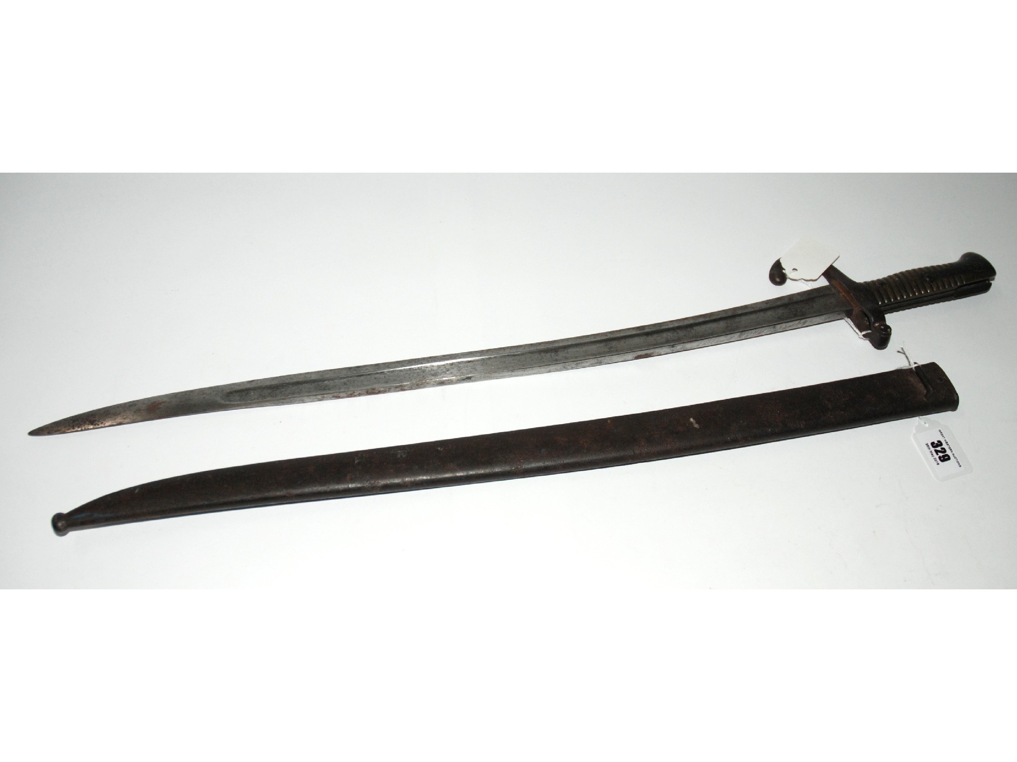 Appraisal: An early bayonet in metal scabbard the top of the