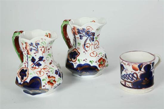 Appraisal: THREE PIECES GAUDY DECORATED CHINA Two Sunflower pattern pitchers with