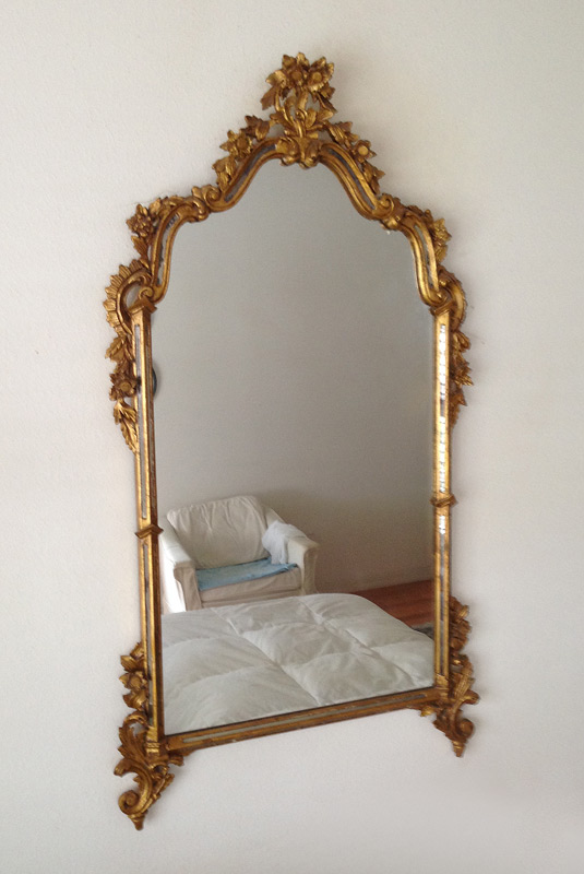 Appraisal: CARVED GILT WOOD WALL MIRROR Frame carved with floral and