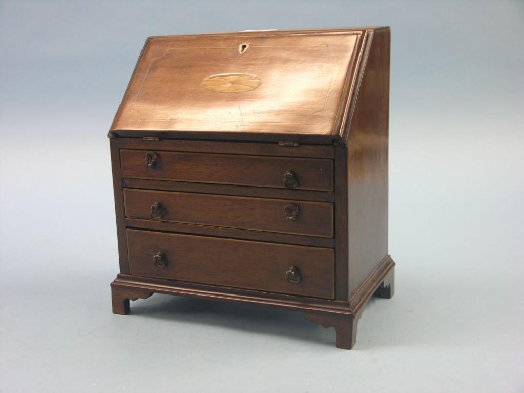 Appraisal: A Victorian mahogany miniature bureau inlaid fall-front enclosing pigeon-holes three