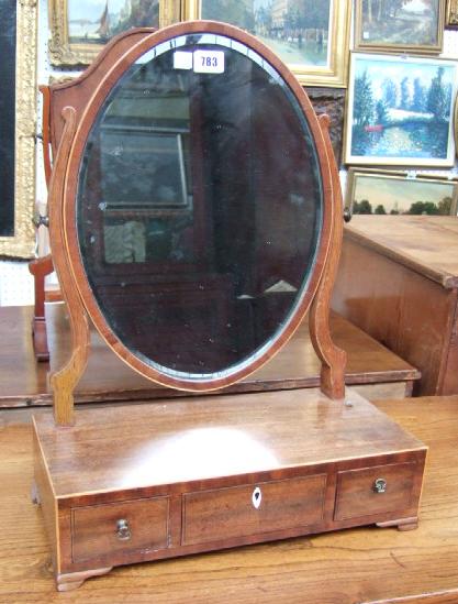 Appraisal: A th century mahogany toilet mirror the oval plate above