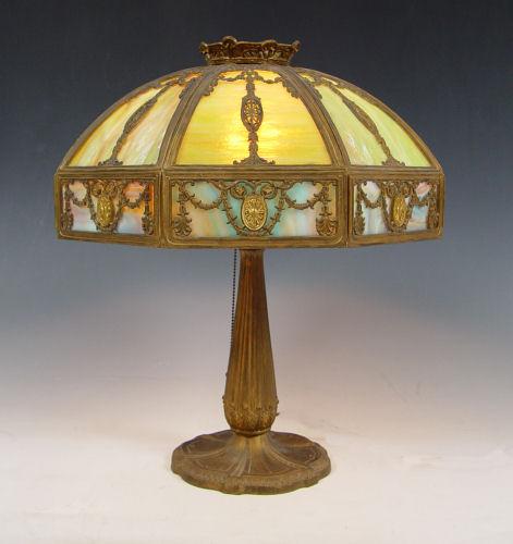 Appraisal: VINTAGE SLAG GLASS TABLE LAMP Eight panel filigree metal domed