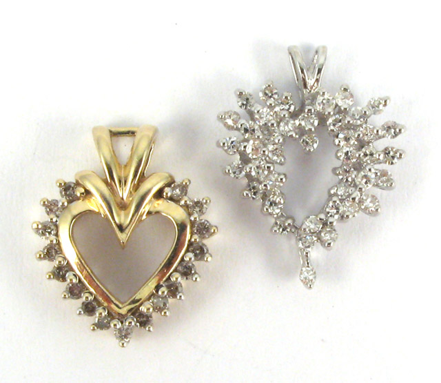 Appraisal: TWO DIAMOND OPEN HEART PENDANTS one of K white gold