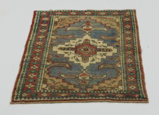 Appraisal: Hand knotted Caucasian wool rug x Hand-knotted wool Caucasian rug