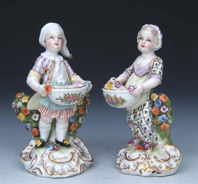 Appraisal: A PAIR OF TH CENTURY GERMAN PORCELAIN FIGURES of a