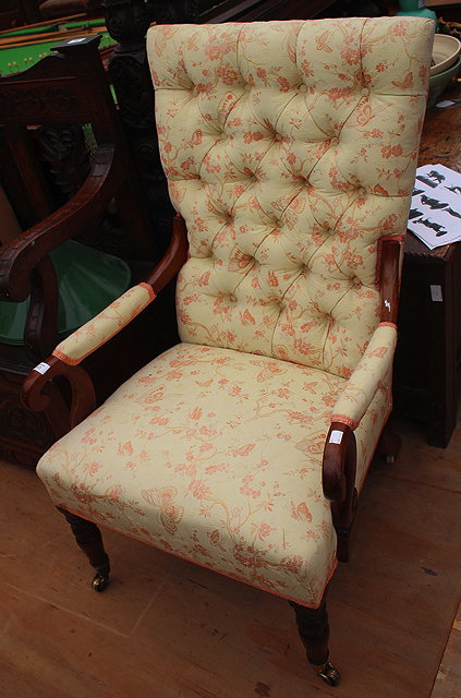 Appraisal: A TH CENTURY MAHOGANY OPEN ARMCHAIR with button upholstered back