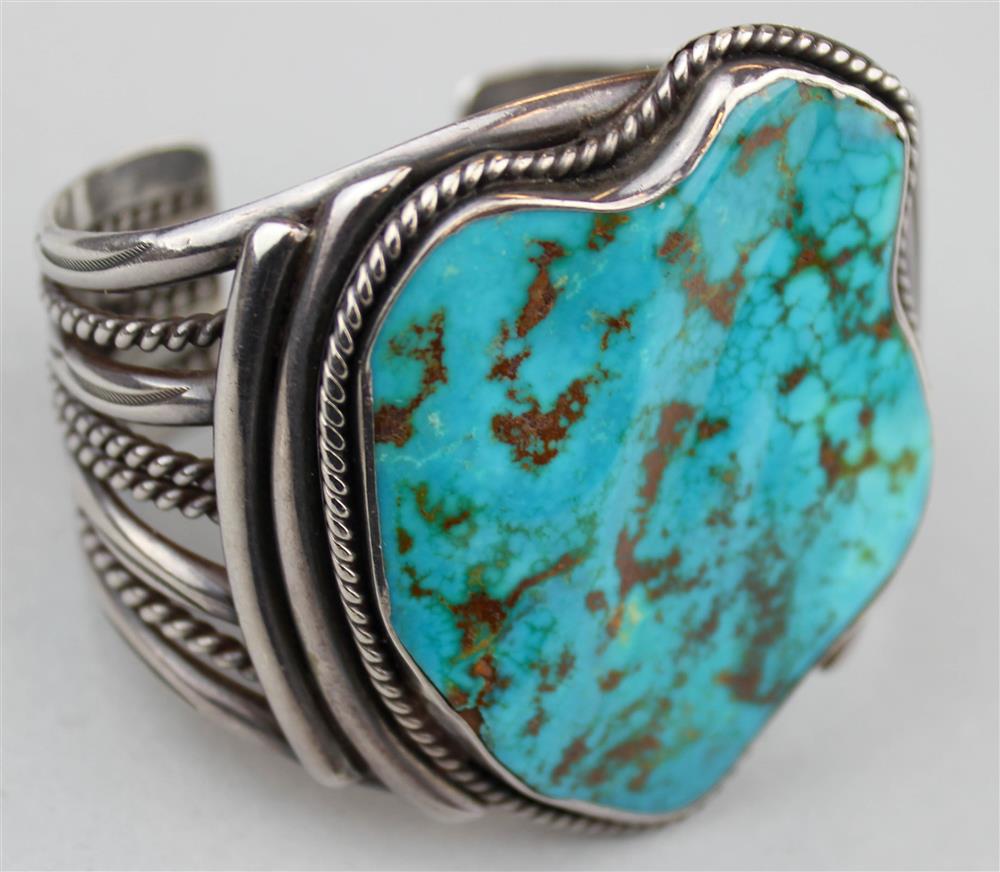 Appraisal: NAVAJO SILVER AND TURQUOISE CUFF BRACELET HIGHLY POLISHED AND SCULPTED