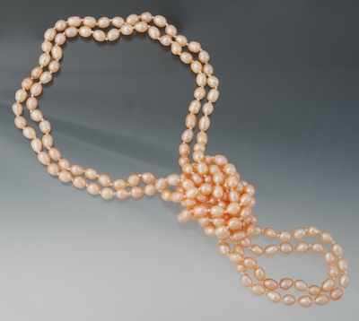 Appraisal: A Rope Length Peach Color Pearl Necklace A continuous strand