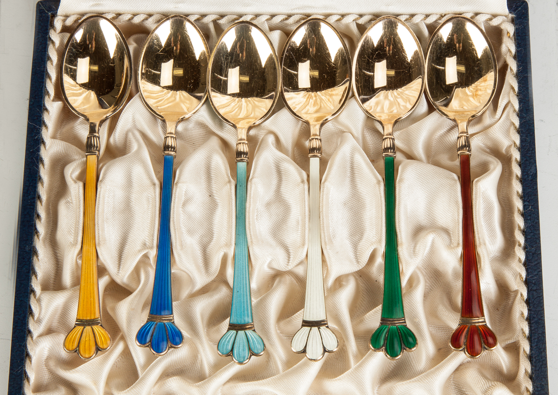 Appraisal: Enameled Sterling Silver Demitasse Spoons with Cases ozt