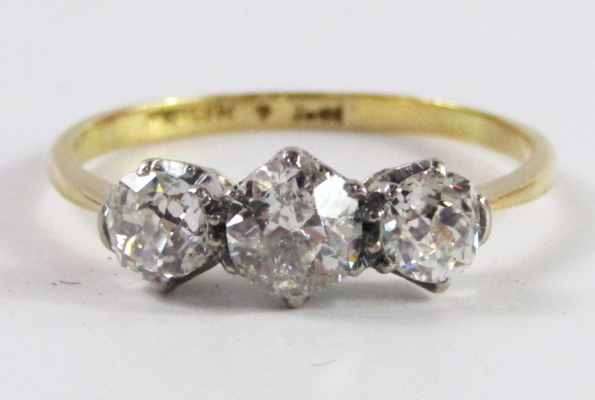 Appraisal: A three stone diamond half hoop ring with ct gold