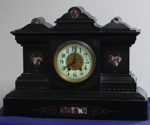 Appraisal: A French mantel clock in a Belgian slate and marble