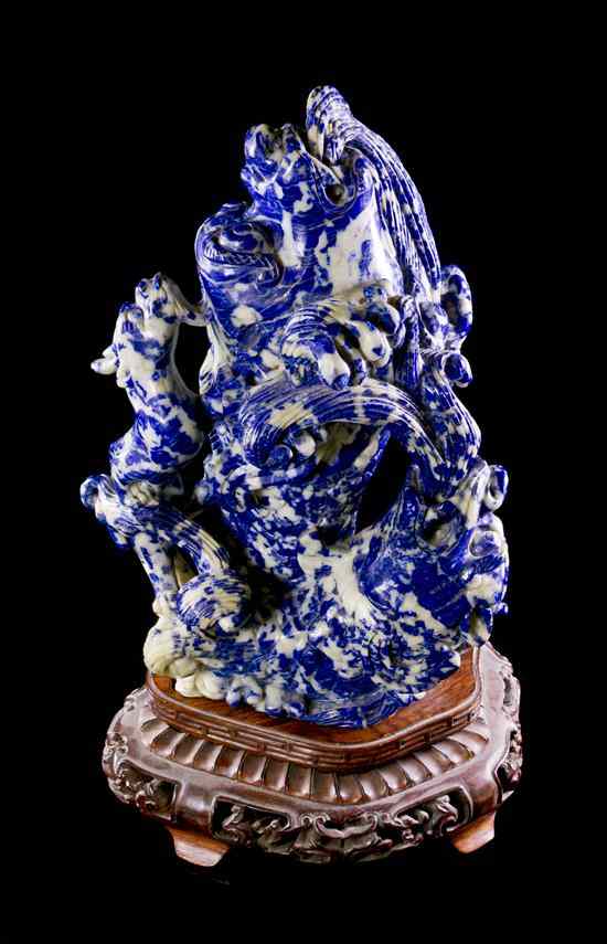 Appraisal: A Chinese Lapis Lazuli Carving depicting two fish leaping out