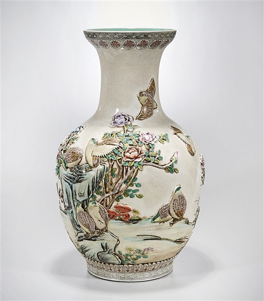 Appraisal: Tall Chinese enameled porcelain vase molded birds and flowers decoration