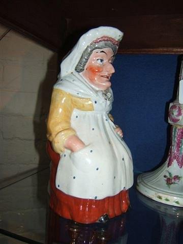 Appraisal: A mid th Century pottery Toby jug in the form