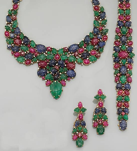 Appraisal: the necklace of tapering design set with carved emeralds rubies